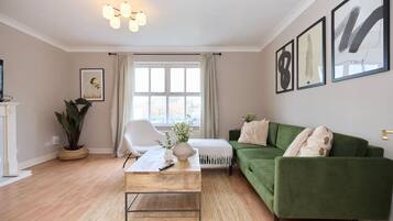 Apartment (3 Bedrooms) | Living area | 32-inch Smart TV with cable channels