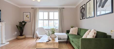 Apartment (3 Bedrooms) | Living area | 32-inch Smart TV with cable channels