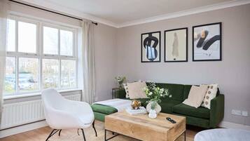 Apartment (3 Bedrooms) | Living area | 32-inch Smart TV with cable channels