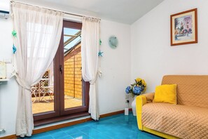 Panoramic Apartment, Partial Sea View | Living area | 30-inch flat-screen TV with digital channels