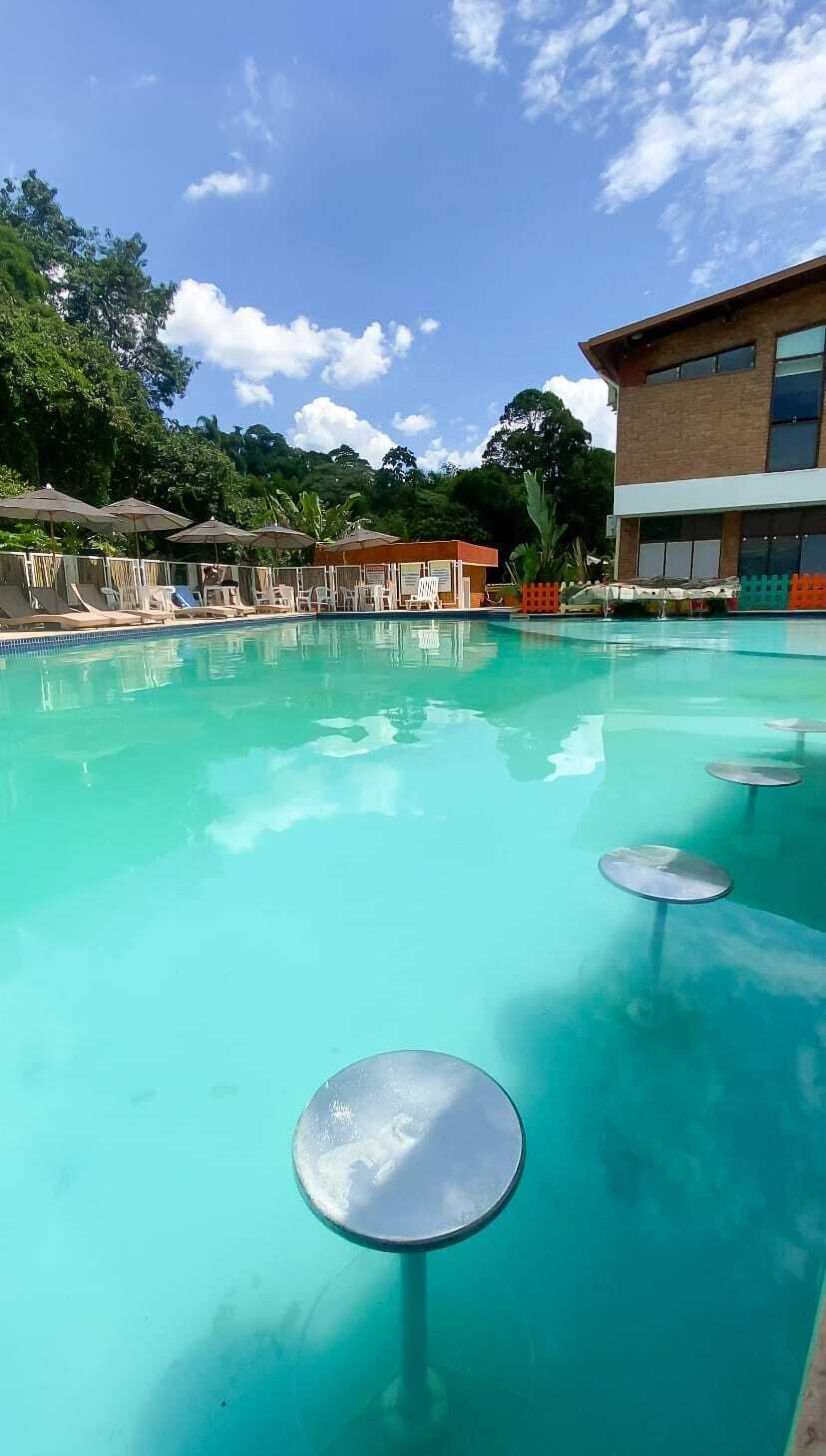 2 outdoor pools, open 10:00 AM to 10:00 PM, pool umbrellas, sun loungers