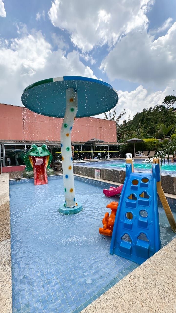A water play area with slides and a water fountain.