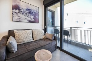 TV, fireplace - Cozy 1BR Apartment in Mendele by HolyGuest (Tel Aviv)