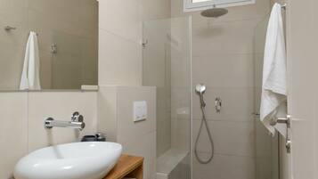 Shower, hair dryer, towels, toilet paper