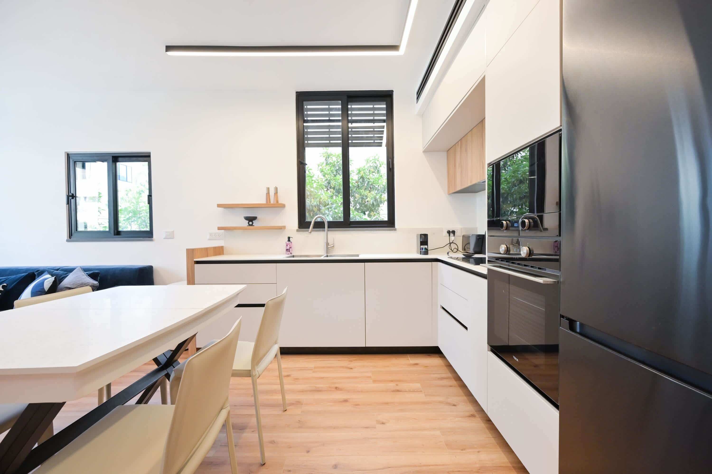 Fridge, stovetop, dishwasher, coffee/tea maker