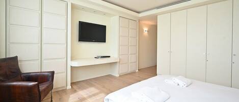 1 bedroom, desk, iron/ironing board, travel crib