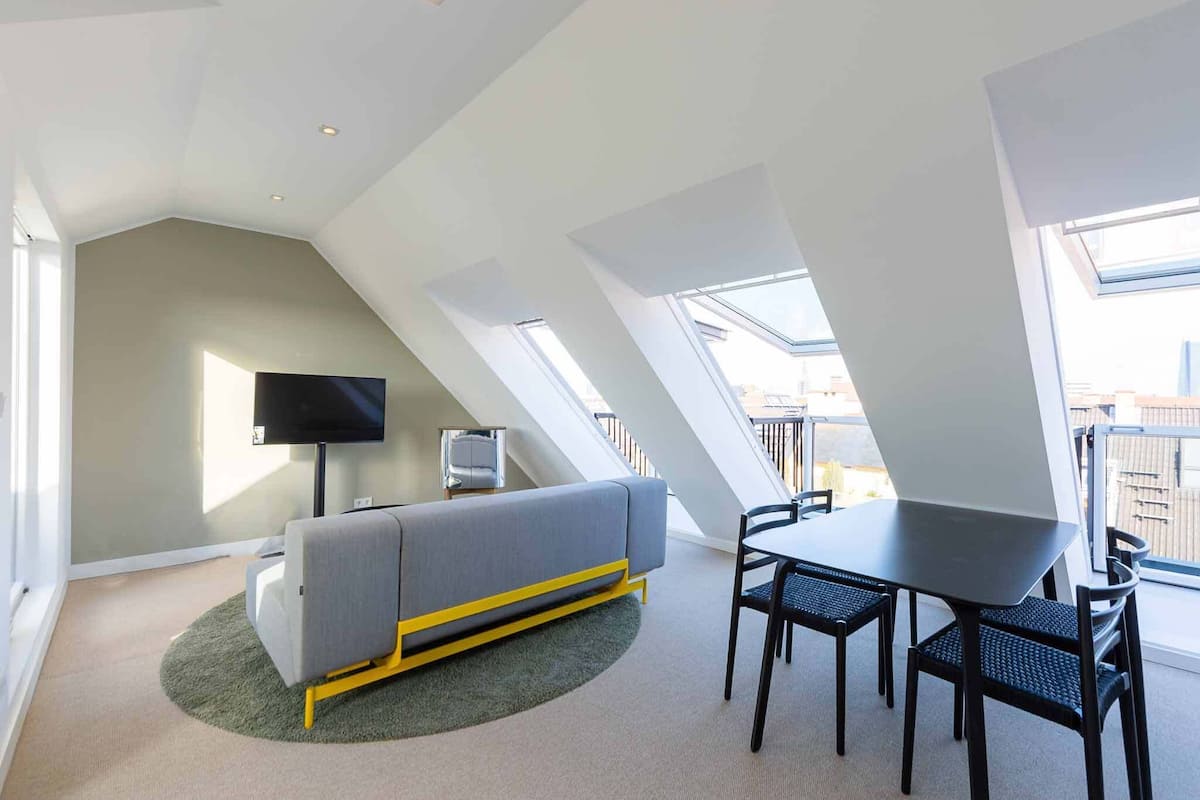 Deluxe Duplex | Living area | 40-inch Smart TV with satellite channels
