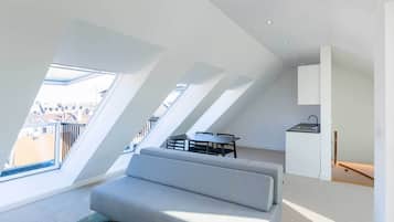 Deluxe Duplex | Living area | 40-inch Smart TV with satellite channels