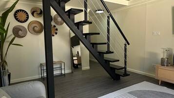 Superior Studio Suite, Courtyard View | Living area | TV