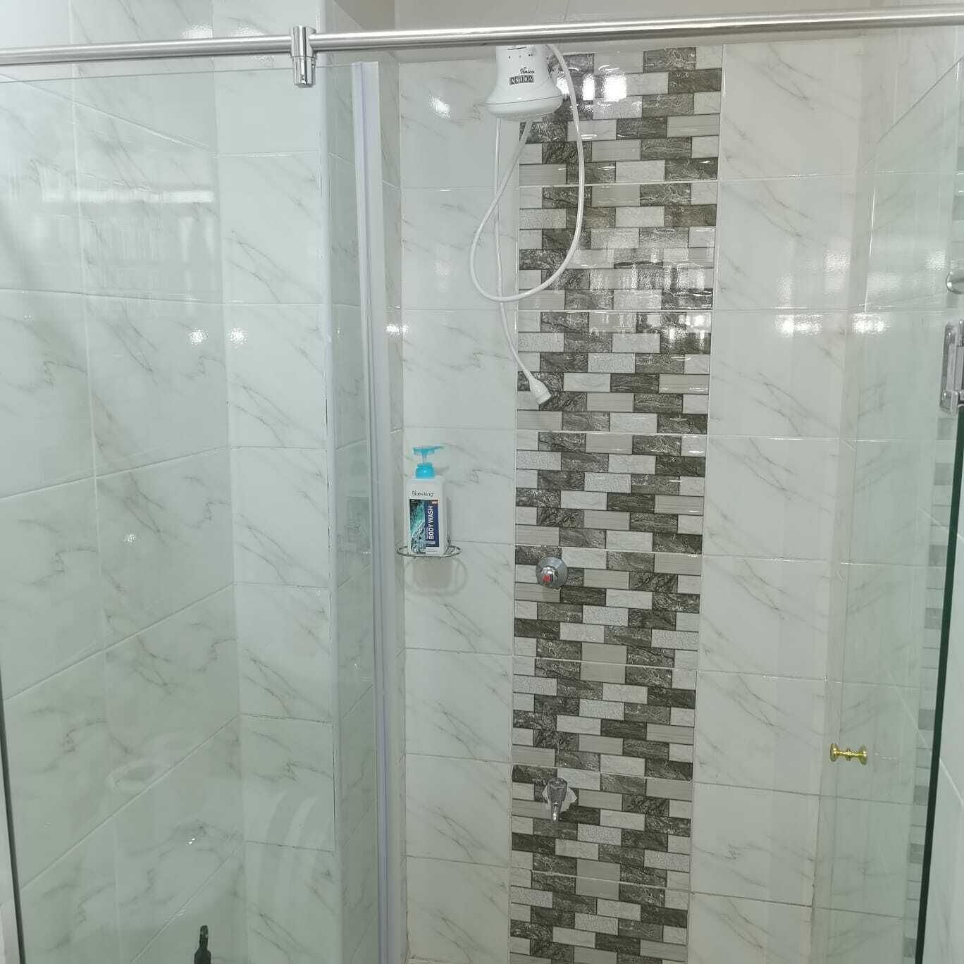 Design Apartment | Bathroom | Shower, slippers, towels, soap