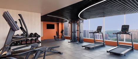A gym with treadmills, elliptical machines, and weight machines.