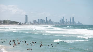 Beach nearby, white sand, beach towels