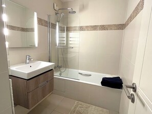 Shower, hair dryer, towels, toilet paper