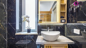 Family Quadruple Room | Bathroom | Shower, hair dryer, towels, soap