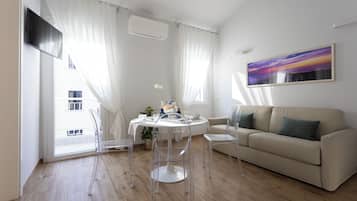 Appartamento Superior, 1 camera da letto | Area soggiorno | TV a schermo piatto