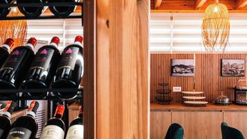 A wooden interior with wine racks and a bar area.