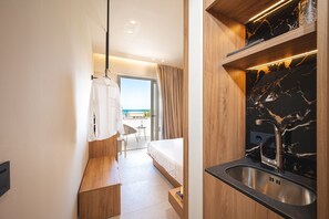 Deluxe Double Room, Balcony, Sea View | 1 bedroom, in-room safe, blackout drapes, iron/ironing board