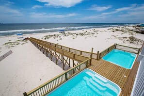 A beachside property with a wooden deck, two hot tubs, and a view of the ocean. - Beachfront 18bed Pool Easybreezy (Gulf Shores)