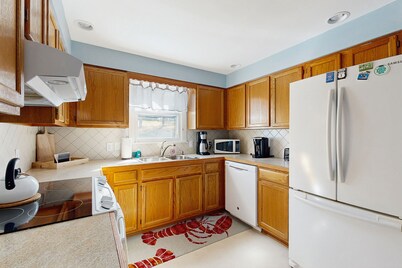 Charming Coastal House with Cozy Living Spaces and Outdoor Firepit