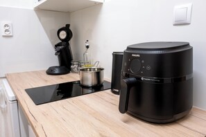 Fridge, microwave, stovetop, coffee/tea maker