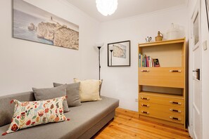 Basic Apartment, 1 Bedroom | Living area | 32-inch TV with cable channels