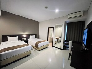 Habitación Deluxe con 2 camas individuales | 1 dormitorio, sistema de insonorización, wifi gratis y ropa de cama
