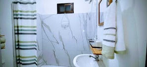Shower, hair dryer, towels, soap