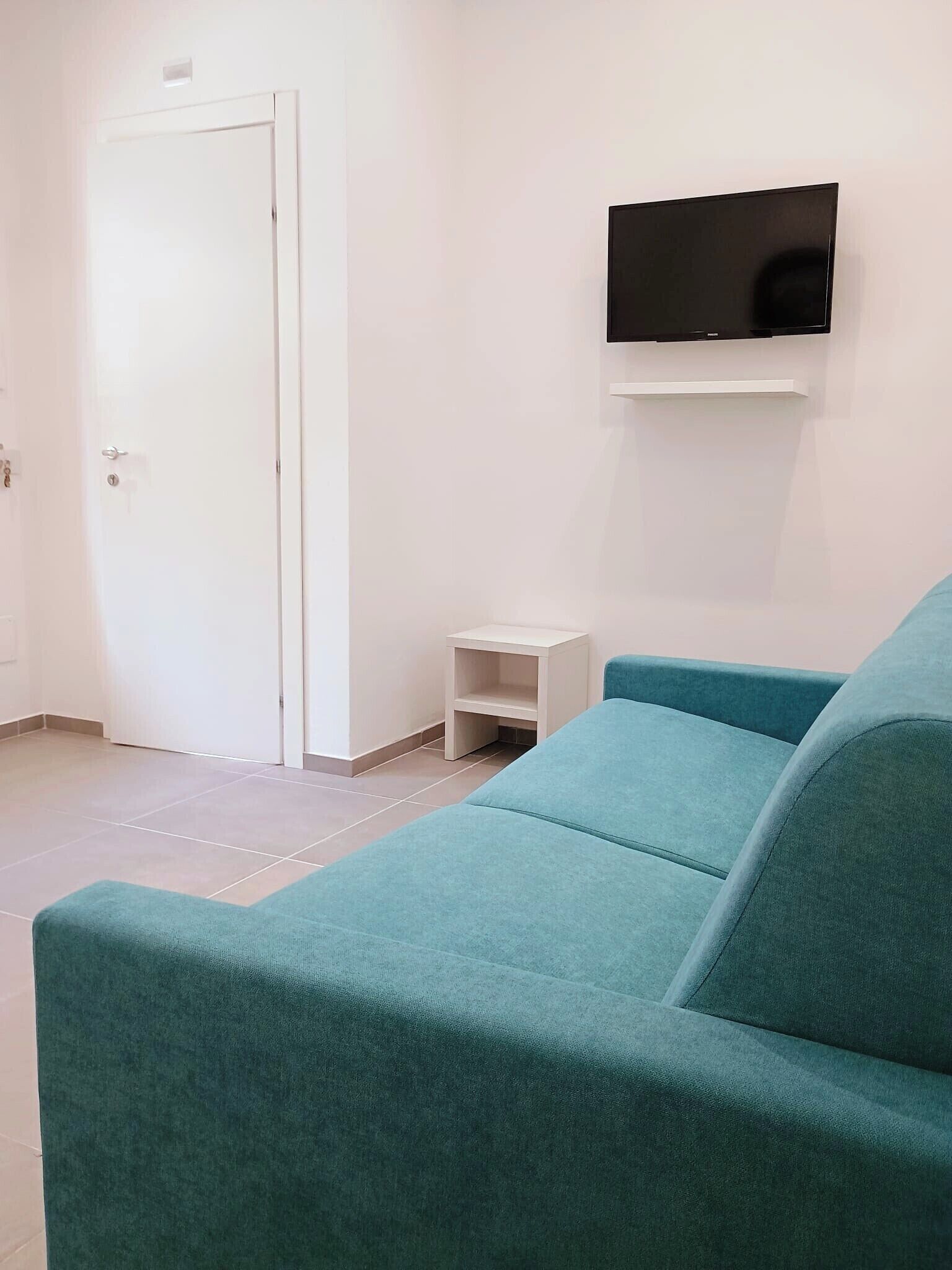 Appartement Deluxe, 1 grand lit et 1 canapé-lit | Aire de séjour | Téléviseur