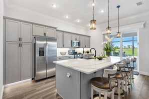 Fridge, microwave, oven, stovetop - Resort Style Home in The Villages, FL - Golf & Waterfront Pool Home in Florida (Wildwood)