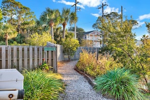 Stroll through lush gardens to tennis and pickleball courts.