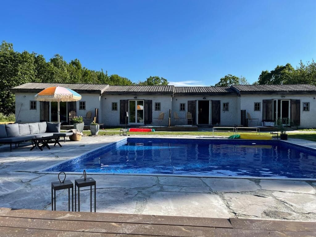 Seasonal outdoor pool, open 10:00 AM to 7:00 PM, pool umbrellas