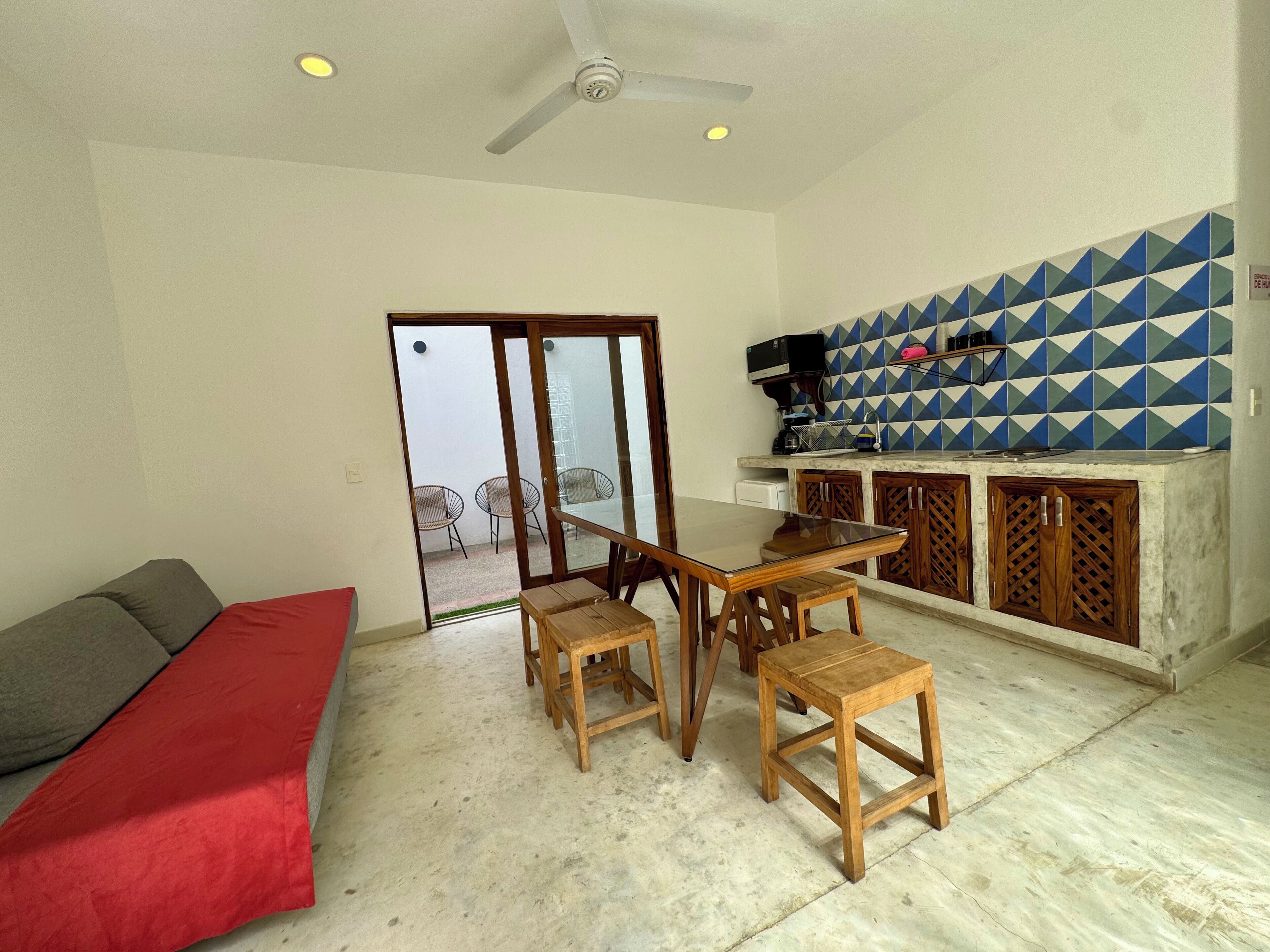 Deluxe Suite, Patio, Courtyard View | Living area | TV