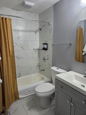 Hair dryer, towels, soap, toilet paper