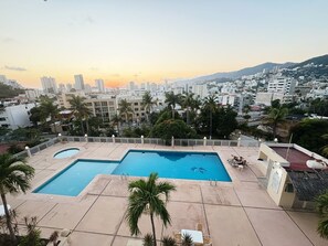 Relax by the rooftop pools surrounded by a cityscape and lounge in style.