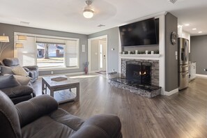 Smart TV, fireplace, books