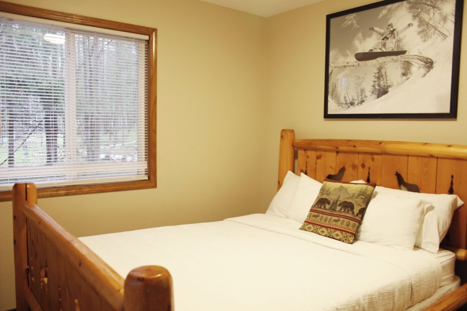 Sink into crisp linens and relax in warm, cabin-style serenity.