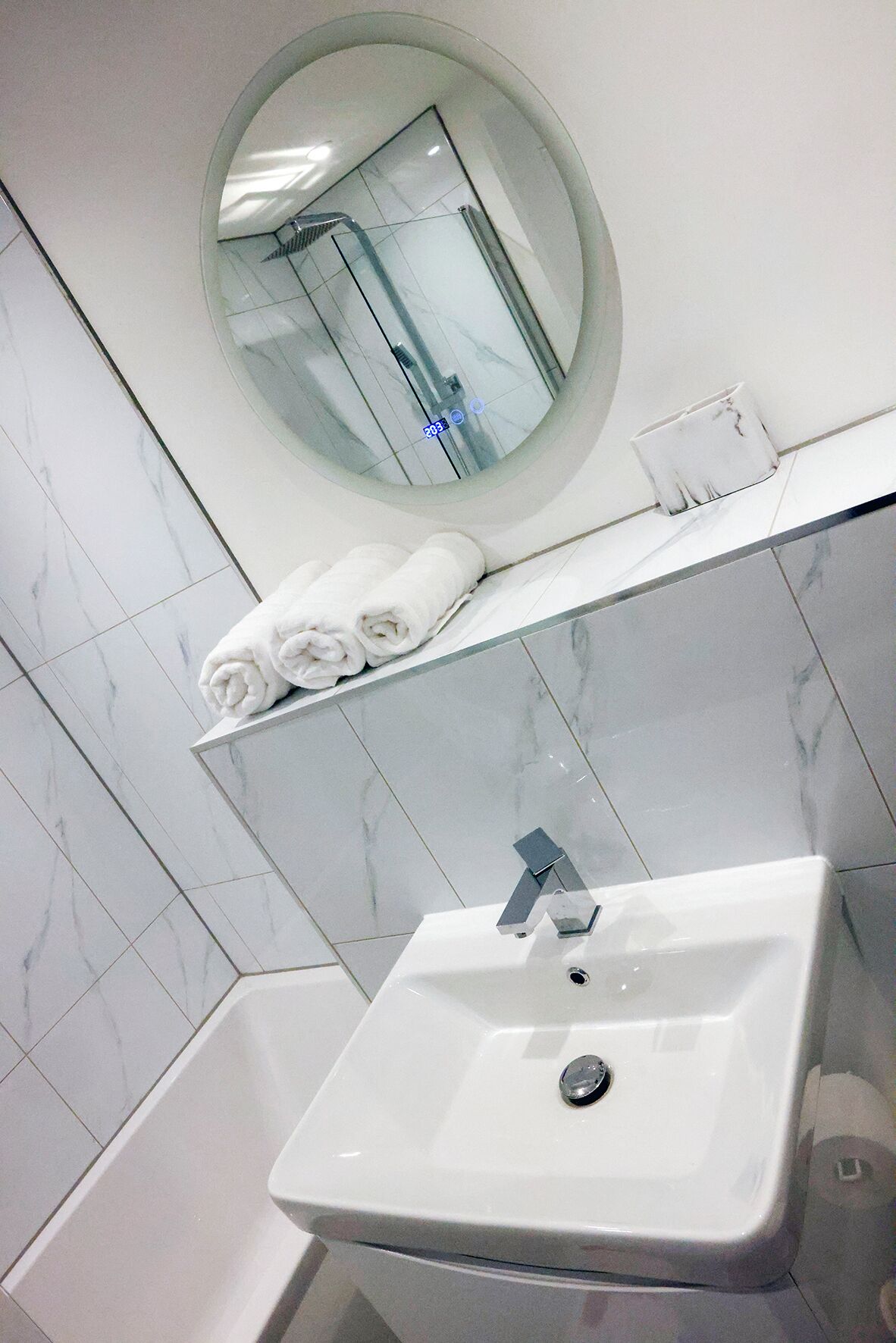 Shower, towels, soap, toilet paper