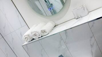 Shower, towels, soap, toilet paper