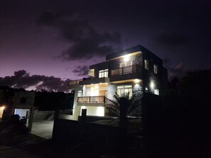 A multi-story building with balconies and a driveway. - Setsuna, Luxury Oceanic View Villa Near Airport (Vieux Fort)
