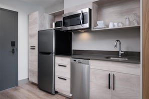 Full-sized fridge, microwave, stovetop, dishwasher