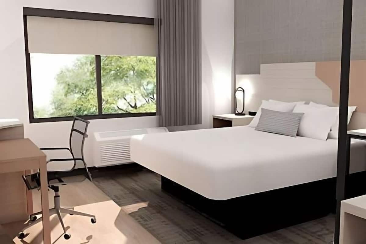 Desk, laptop workspace, blackout drapes, iron/ironing board