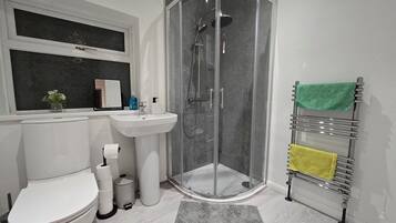 Shower, hair dryer, towels, soap
