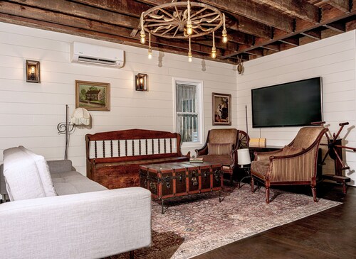 Fully renovated 1800s Carriage House seamlessly blends history w/modern luxury.