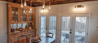 Fully renovated 1800s Carriage House seamlessly blends history w/modern luxury.
