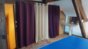 A room with a wooden ceiling, a blue floor, a white sink, and purple curtains. - Large house Loire view + veranda + terrace + garden (Chaumont-sur-Loire)