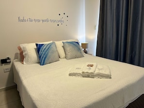 1 bedroom, desk, iron/ironing board, travel crib