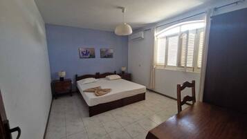 Minibar, desk, bed sheets