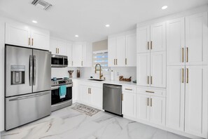 Fridge, microwave, oven, stovetop - "Two for the Tide" unique deal—guests get two units for the price of one. (Key Colony Beach)