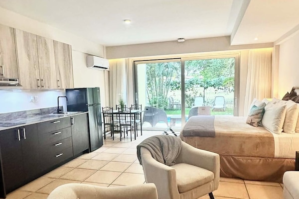 Welcome to your suite with king sized bed and pull out couch (73" w by 53" deep)