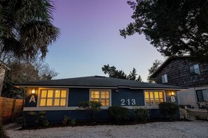 A two-story house with the numbers 213 and letters A and B on the facade, surrounded by trees and a gravel driveway. - 5-Min Walk to Beach, Pet Friendly & Fire Pit (St. Augustine)